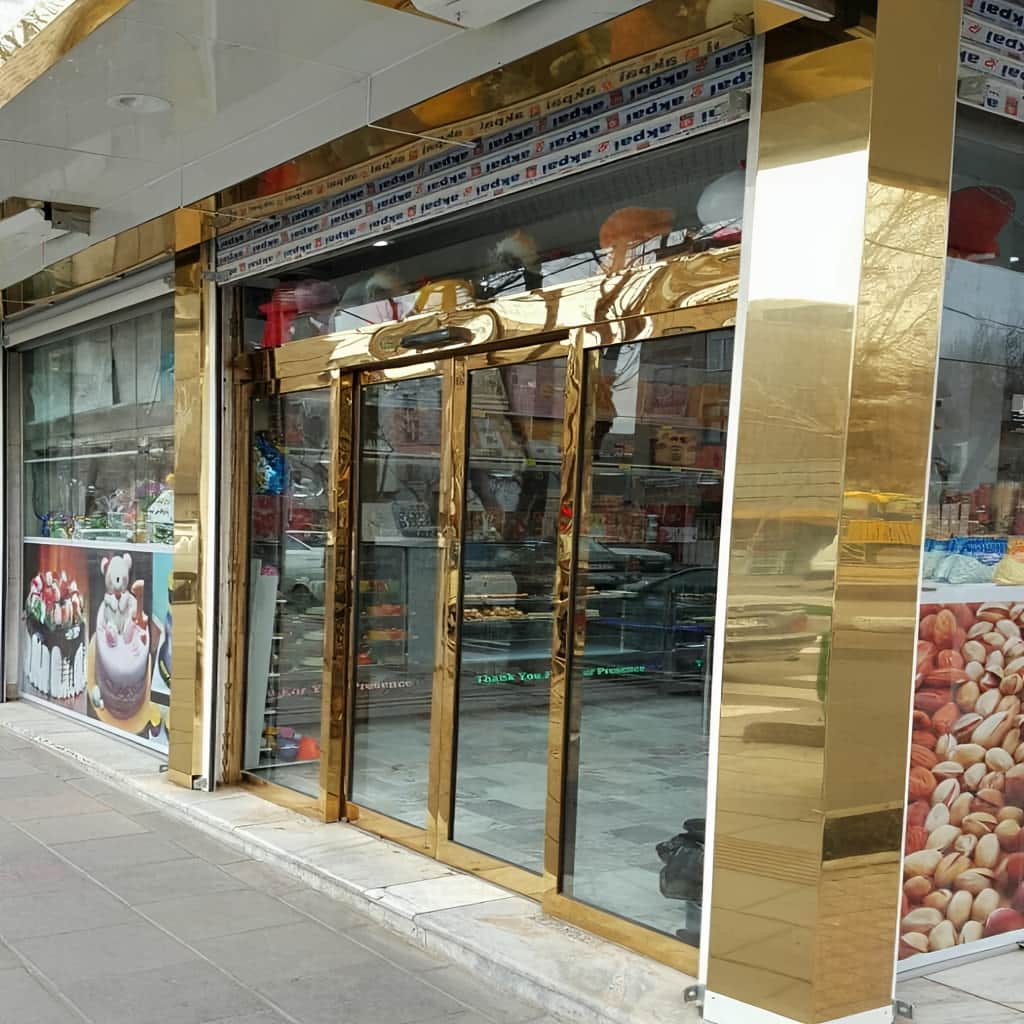 قیمت درب اتوماتیک شیشه ای فریم دار آلومینیوم